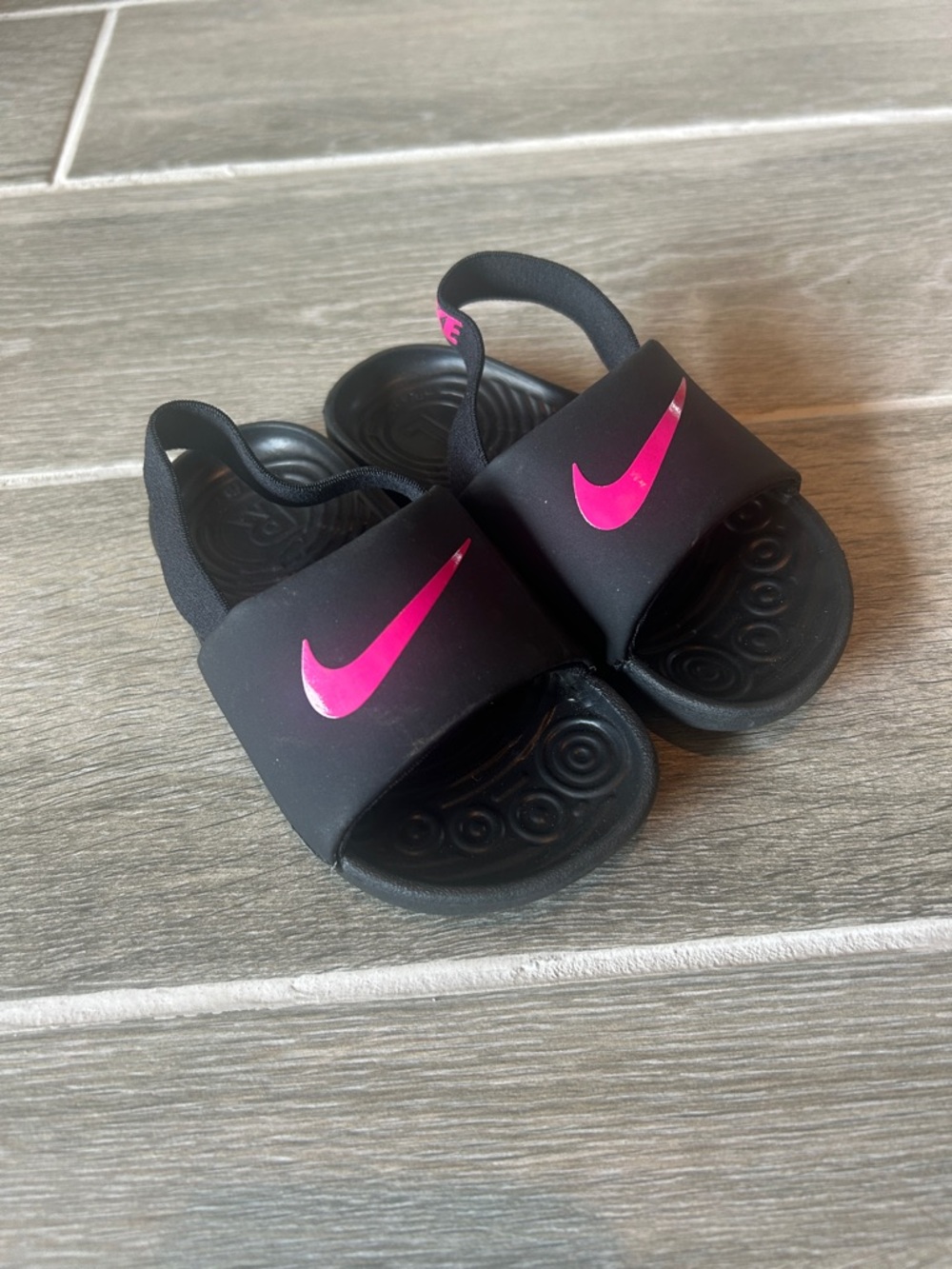 Nike Black Kids Slide Sandals with Pink Swoosh